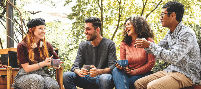 A group of adults together outdoors during a Community Connections activity.